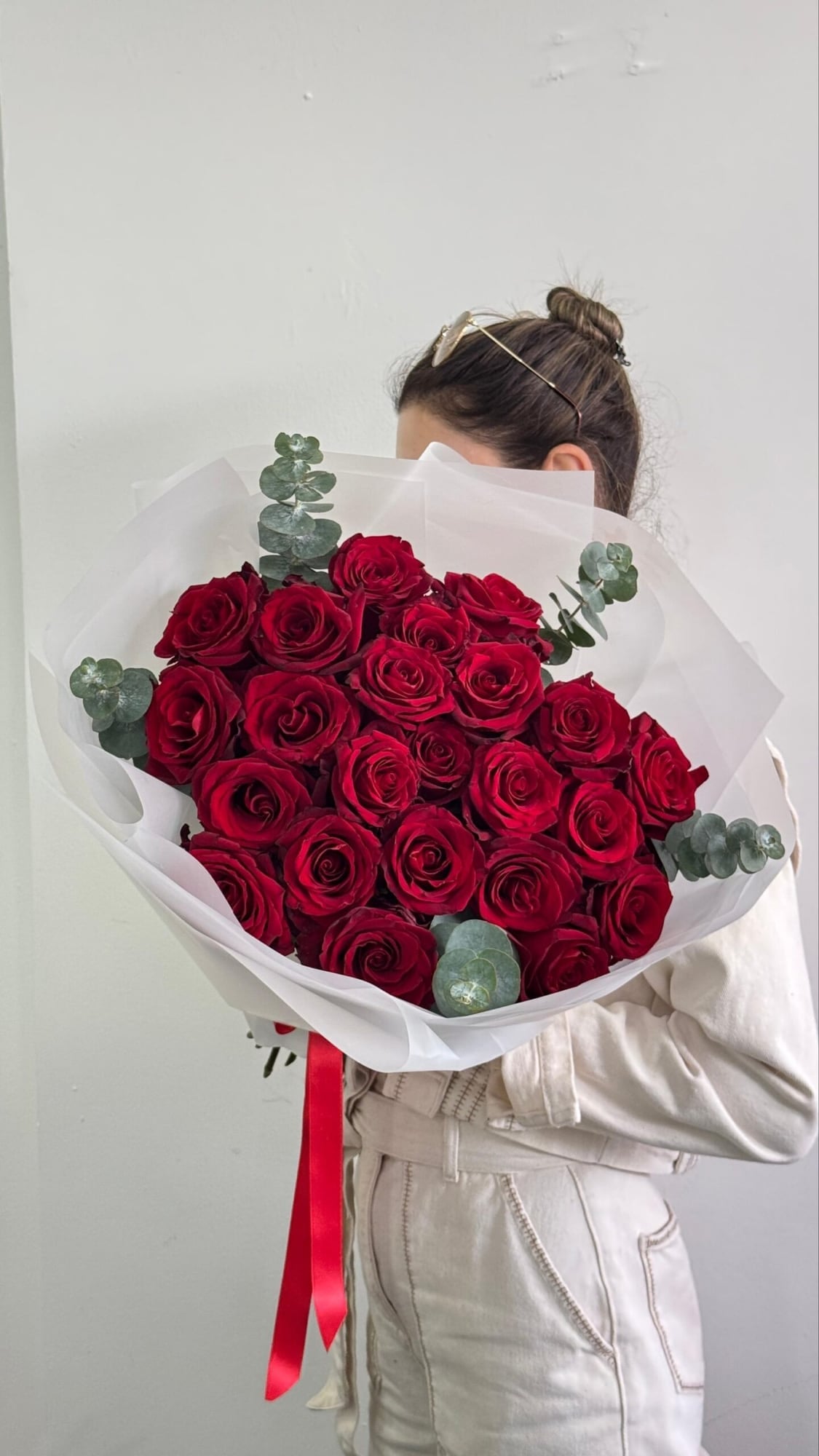 21 Red Roses: 21 red roses with eucalyptus, wrapped in white paper.